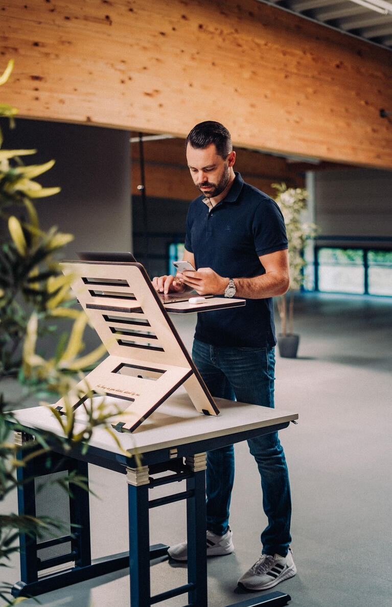 Man at standing desk. Man at standing desk.
